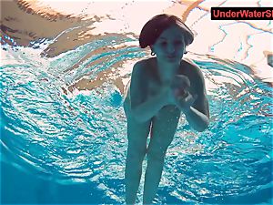 tattooed baby swirls underwater